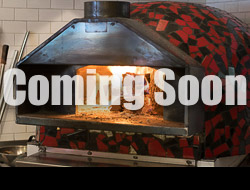 A wood fired pizza oven with a coming soon on the image
