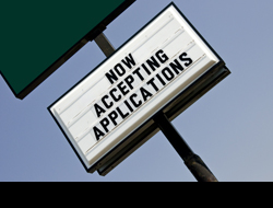 a photo of a business sign that says now accepting applications