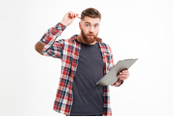 portrait-of-a-pensive-bearded-man-in-plaid-shirt-holding-clipboard-and-scratching-head-with-pencil-over-white-background