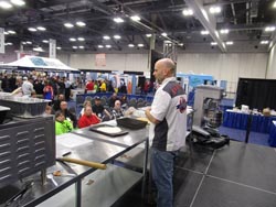 Michael Shepherd speaking to a crowd of people at a food show